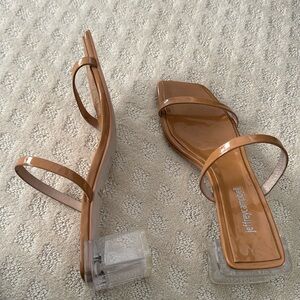 Sleek,square toed heels with clear acrylic block heels and double straps.